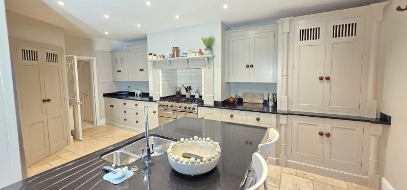Kitchen renovation in Beaumaris with decorated walls and sprayed kitchen units